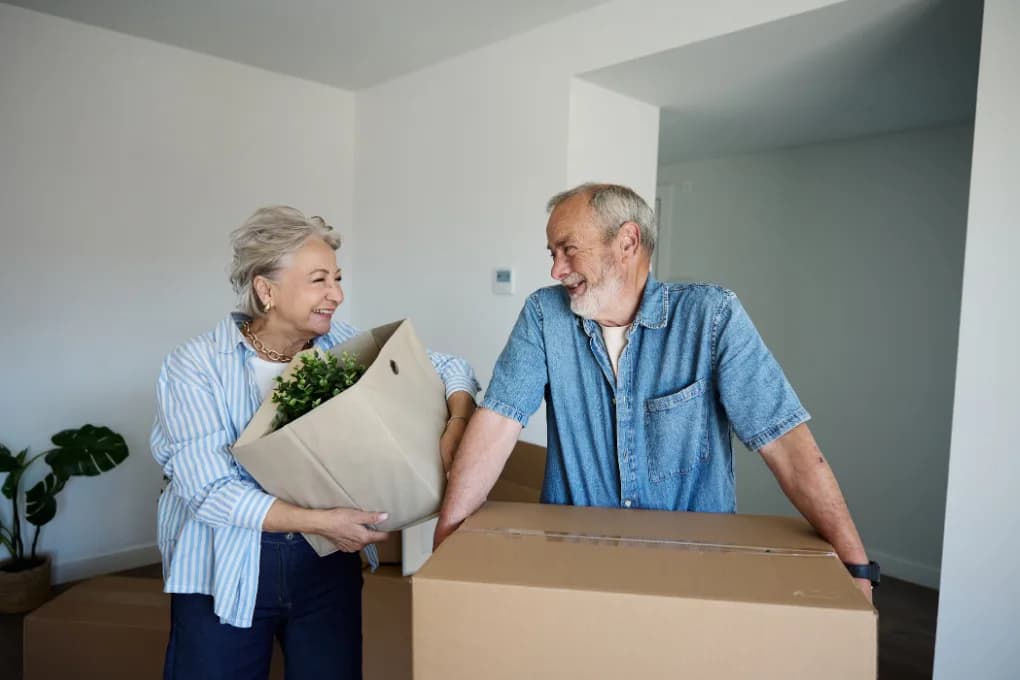 Elderly couple moving into a new house.