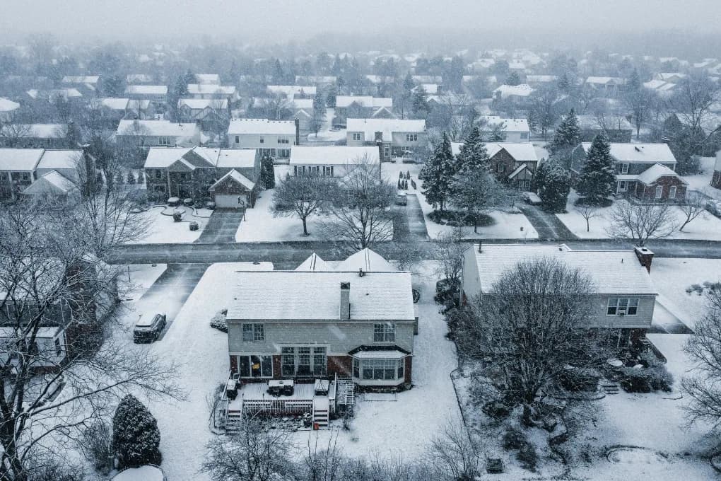 Bird's eye view of a neighborhood after a snowstorm.