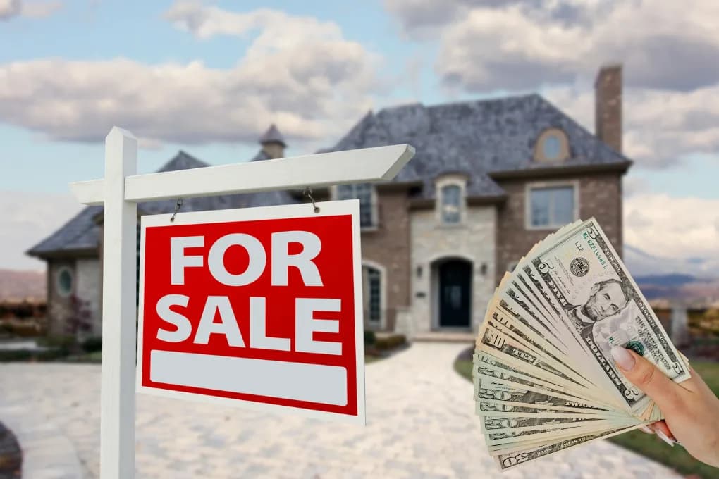 House with for sale sign in front yard and person holding a wad of cash.